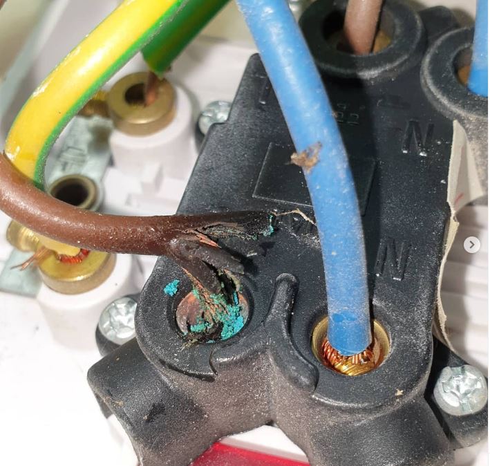 A burnt connector with scorched wiring
